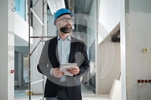 Middle-aged engineer in hardhat