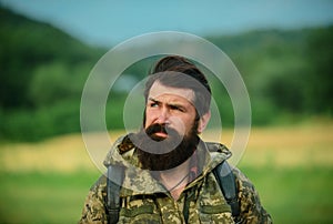 Middle aged farmer, closeup male farmer portrait. Portrait of middle aged bearded man, outdoors in meadow. Man portrait