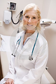 Middle Aged Female Doctor In Hospital Ward