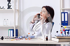 Middle-aged female doctor in telemedicine concept