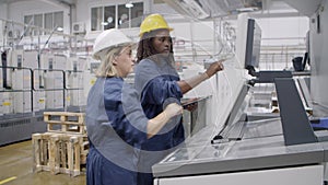 Middle aged female factory worker taking proficiency exam