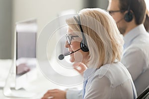 Middle-aged female operator consult client in customer service