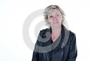 Middle aged fifties aged woman in retro clothes biker black leather perfecto jacket on white background photo