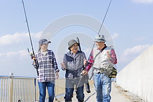 Middle-aged Japanese group enjoying fishing