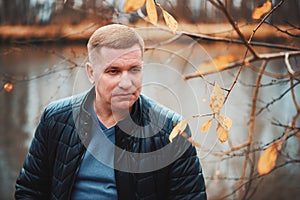 Middle aged man in the autumn park