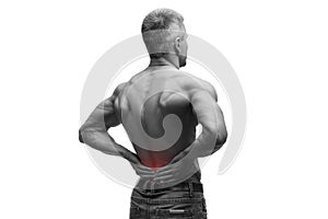 Middle aged man with back pain, muscular male body, studio isolated shot on white background with red dot