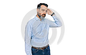 Middle aged man with beard wearing business shirt confuse and wondering about question
