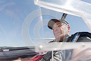 middle-aged man in cockpit sailplane