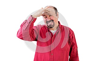 Middle aged man in distress with hand on forehead