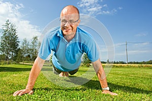 Middle-aged man doing push-ups