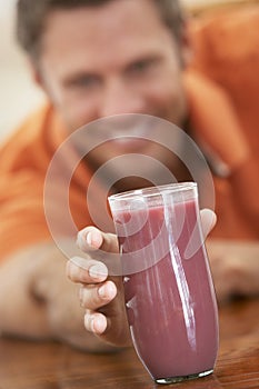 Middle Aged Man Drinking Fresh Berry Smoothie