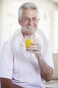 Middle Aged Man Drinking Orange Juice