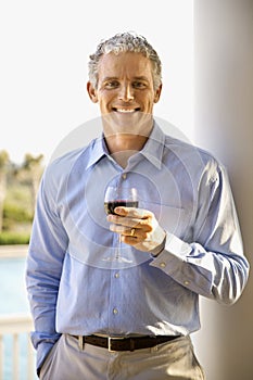 Middle Aged Man Drinking Wine