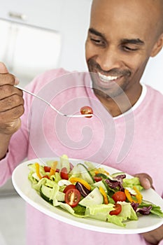 Middle Aged Man Eating Healthy Salad