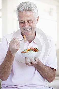 Middle Aged Man Eating Salad