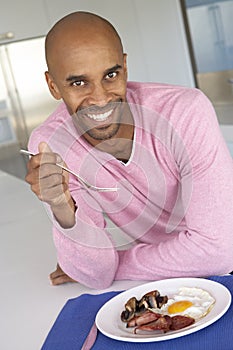 Middle Aged Man Eating Unhealthy Fried Breakfast