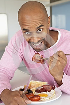 Middle Aged Man Eating Unhealthy Fried Breakfast