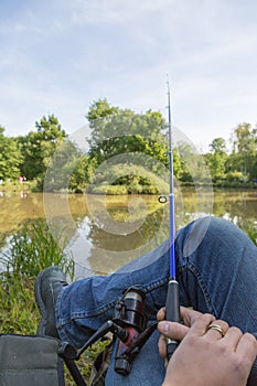 Middle-aged man, a European, fishing busy day. fishing on the lake in summer day