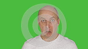 Middle aged man feeling fear. Alpha channel, keyed green screen.