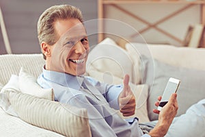 Middle aged man with gadget
