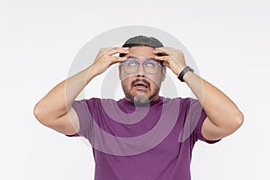 A middle aged man going crazy, rolling his eyes up, going loco. Isolated on a white background