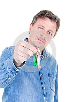 Middle aged man hand over keys with empty white background