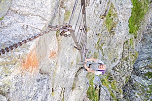 Middle aged man hiking and climbing mountains.