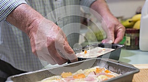 Middle-aged Man Holding Vegetable Terrine.