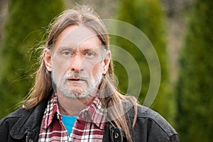 Middle aged man with long hair