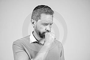 Middle-aged man manager coughing of respiratory infection blue background, cough