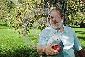 Middle aged man in orchard