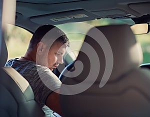 A middle-aged man sits in a car. Dear beautiful car. The man is calm and confident.