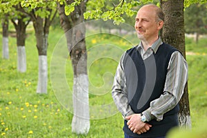 Middle-aged man in summer garden