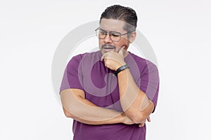A middle aged man thinking while looking confused. Wearing a purple waffle shirt. Isolated on a white background