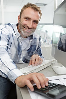 middle-aged man using desktop computer