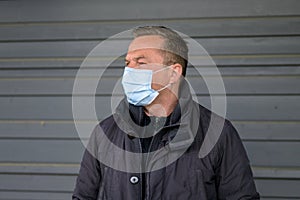 Middle-aged man wearing a face mask during the Covid-19 pandemic