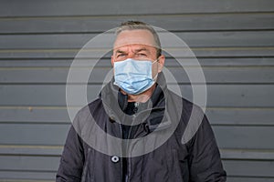 Middle-aged man wearing a protective face mask during the Covid-19 pandemic