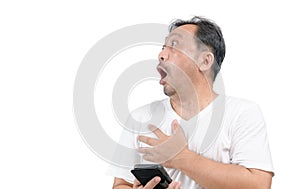 Middle-aged man wearing a white T-shirt hold smart phone and  extremely shocked isolated