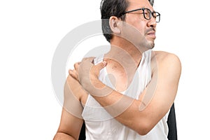 A middle aged man in white veat suffering from neck and shoulder pain