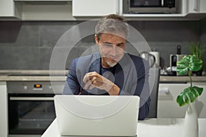 Middle aged man working with computer at home