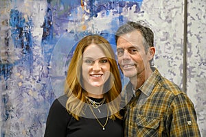 Middle-aged married couple posing at Thanksgiving dinner in Edmond, Oklahoma.