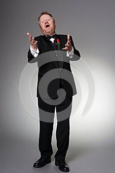 Middle aged opera singer performing photo