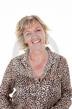 Middle aged senior blonde caucasian woman portrait blond smiling happy in leopard shirt on white background