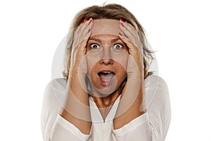 Middle-aged shocked woman