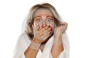 Middle-aged shocked woman