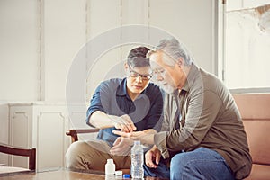 Middle aged son takes care of sick senior father, Happiness Asian family concepts