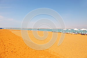 Middle-aged woman on the beach luxury hotel