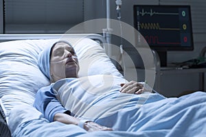 Middle-aged woman with cancer dying