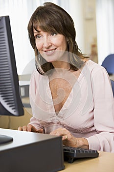 Middle aged woman on a computer