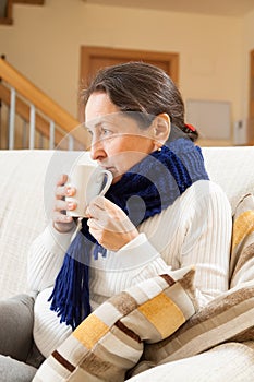 Middle-aged woman with cup of tea